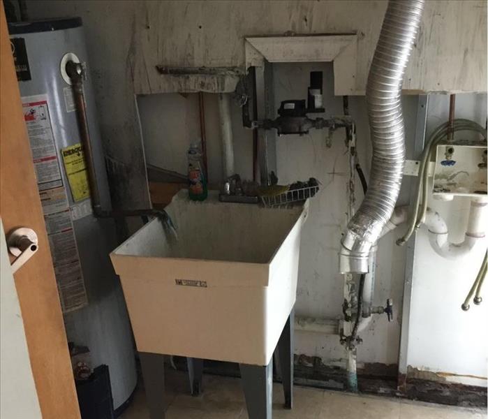 A fully mitigated laundry room after a dryer fire